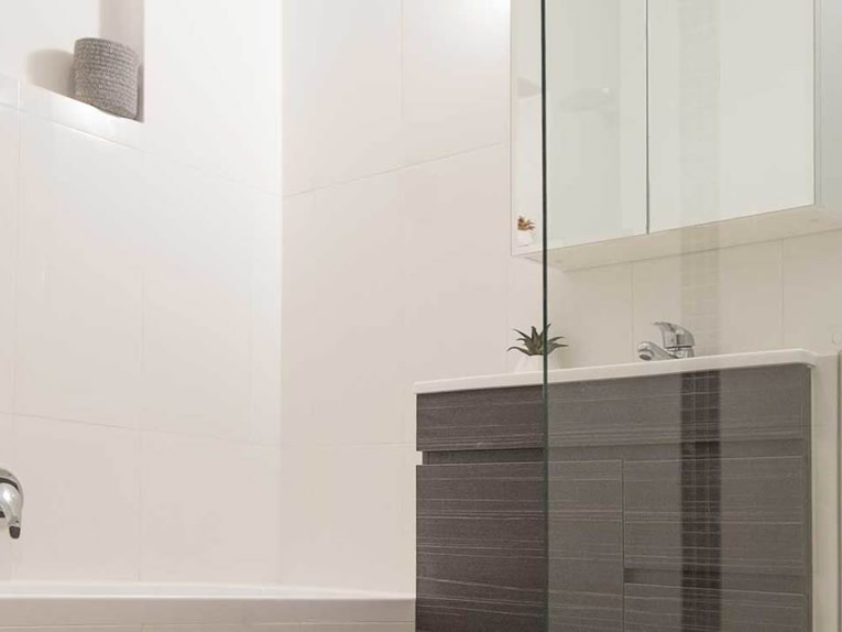 Modern bathroom renovation in Adelaide showing bath